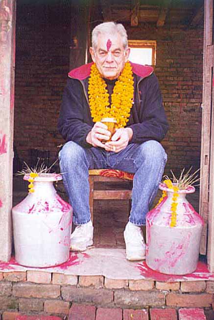 Uncle Bill relaxes at the door of BirGorkha with beer and cigarette